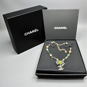 CHANEL Gold Necklace with Green Accent